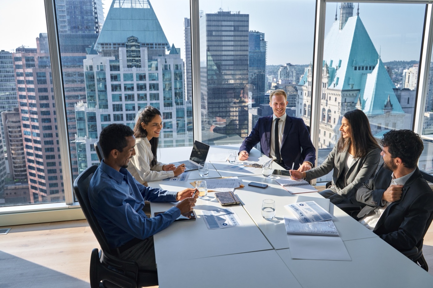 Maximy's executive team in a boardroom discussion